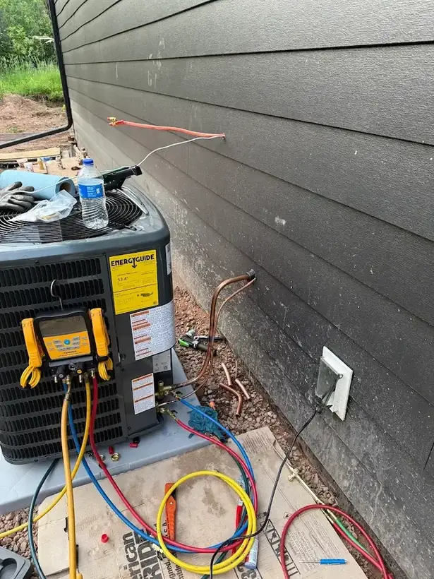 Gauges connected to an outdoor unit during commissioning