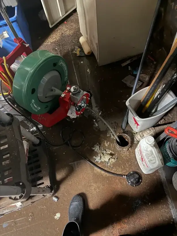 Drain machine clearing a main floor drain