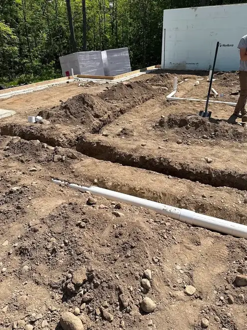 Underground water and drain lines in open trenches